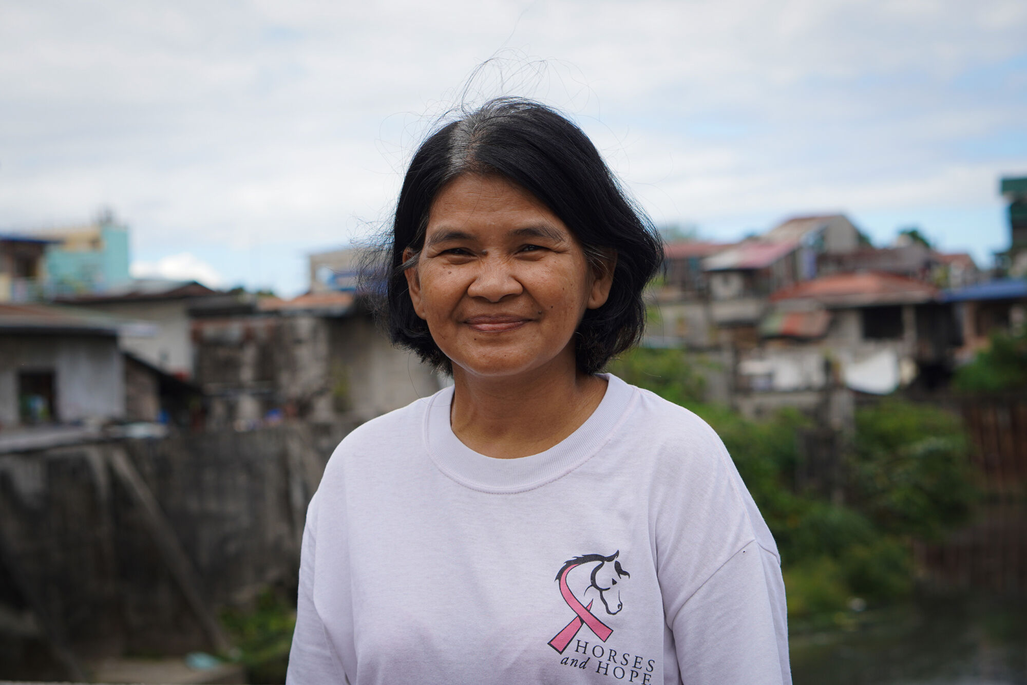 Bild på Arlene Pinto, medlem i ett bostadskooperativ i Filippinerna.
